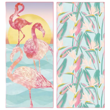 Two beach towels with flamingo and tropical leaf designs on a light blue background.