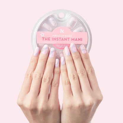 Groovy Swirl - Press-On | Medium | Oval showing medium oval false nails with pink and lavender swirl manicure on hand