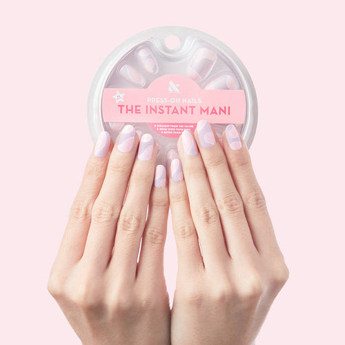 Groovy Swirl - Press-On | Medium | Oval showing medium oval false nails with pink and lavender swirl manicure on hand