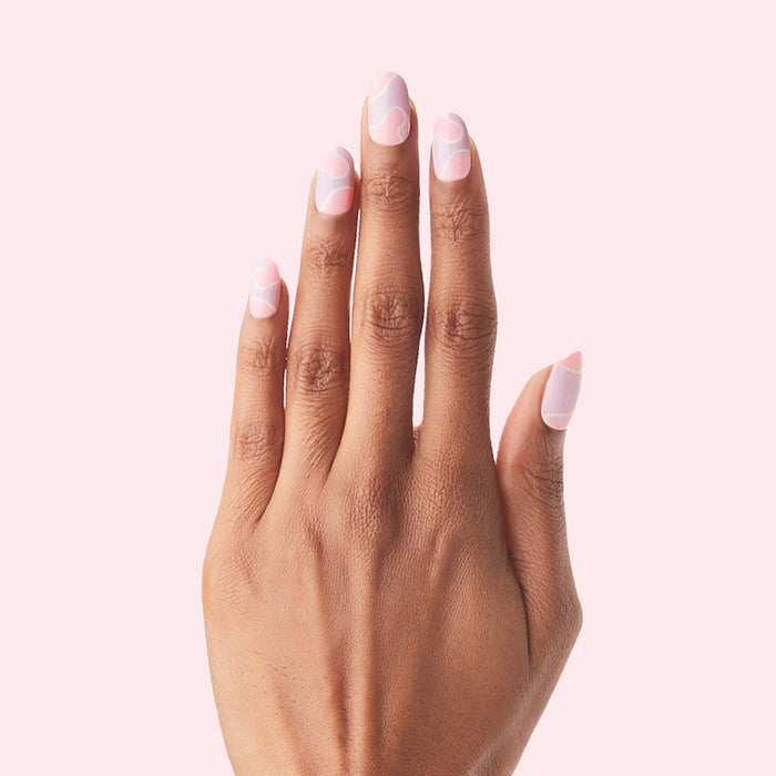 Groovy Swirl - Press-On | Medium | Oval showing medium oval false nails with pink and lavender swirl design on hand