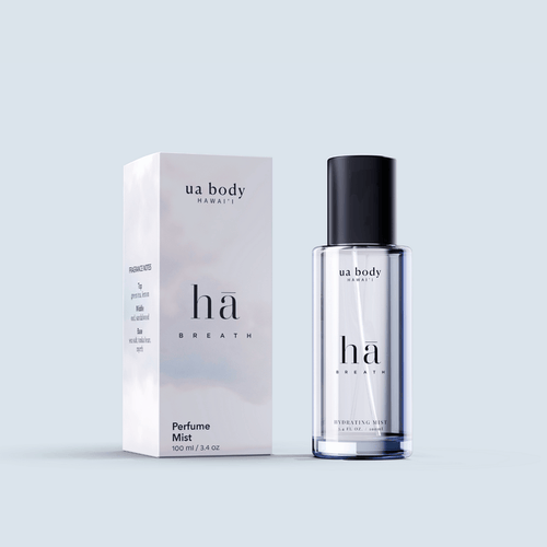 Hā Body Mist with packaging in front of blue background
