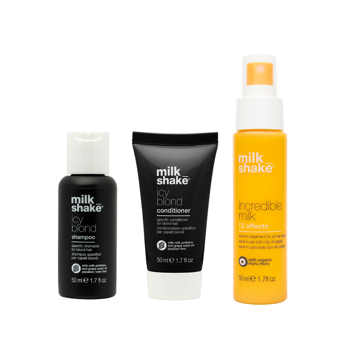 Three bottles of milk shake hair care products on a white background icy blond, incredible milk