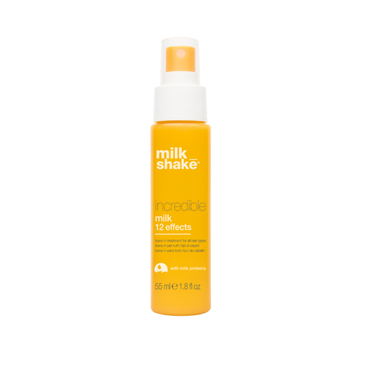Yellow bottle of milk_shake hair product on a white background