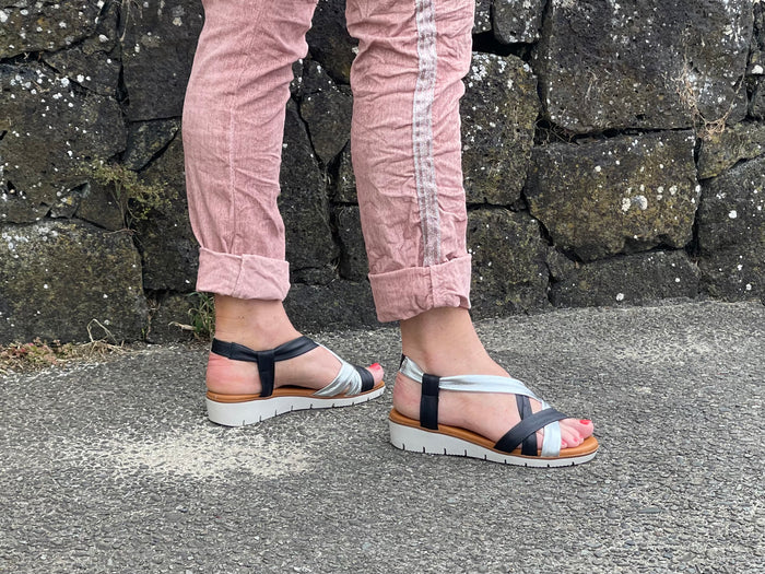 Comfortable women's sandals. European from Spain. Easy to get on with elasticated straps and cushioned wedge sole unit. In black/silver.