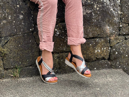 Comfortable women's sandals. European from Spain. Easy to get on with elasticated straps and cushioned wedge sole unit. In black/silver.
