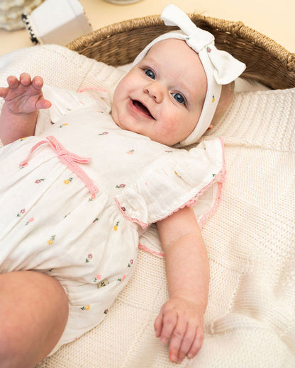 Margot Flower Baby Romper + Headband (Organic) Model