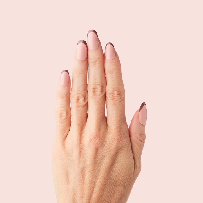 Modern French - Press-On | Medium | Oval hand with medium oval false nails featuring a tonal brown color-blocked French mani design