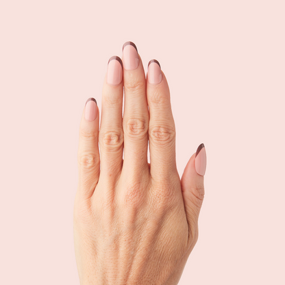 Modern French - Press-On | Medium | Oval hand with medium oval false nails featuring a tonal brown color-blocked French mani design
