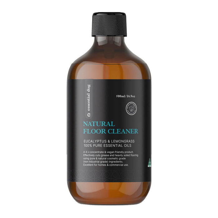 Bottle of natural floor cleaner with a black label on a white background.
