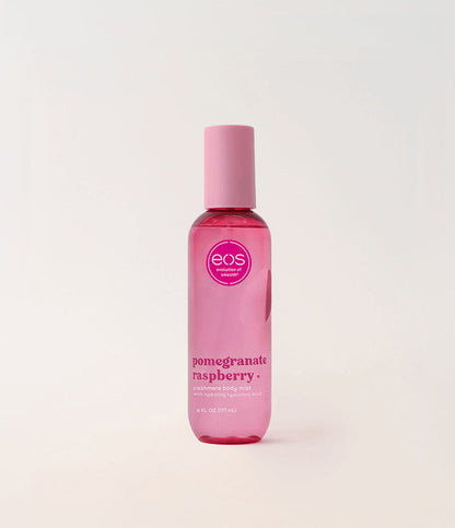 Pink bottle of EOS Pomegranate Raspberry body mist on a light pink background