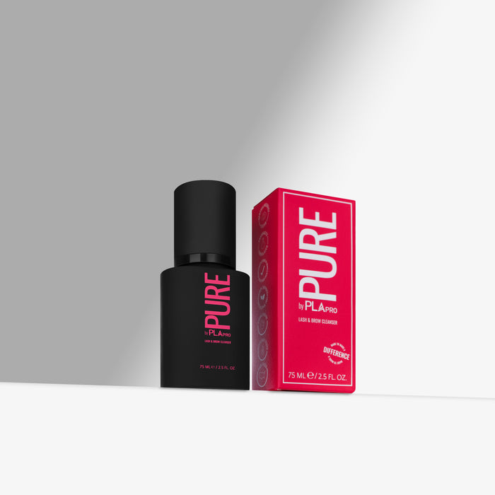 Black cleanser bottle and pink box labeled 'PURE' on a gray background