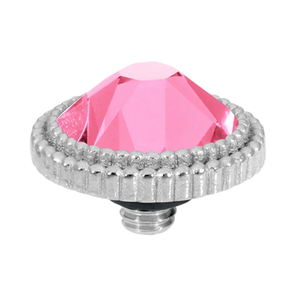 Pink gemstone with silver decorative border on a white background