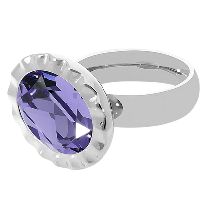Silver ring with a purple gemstone on a white background