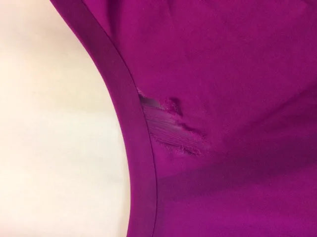 AK race suit repair service image showing a professional repair process for racing suits, emphasizing quick turnaround.