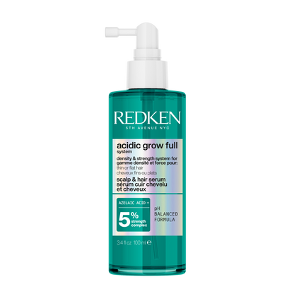 Redken bottle of acidic grow full hair product on a white background
