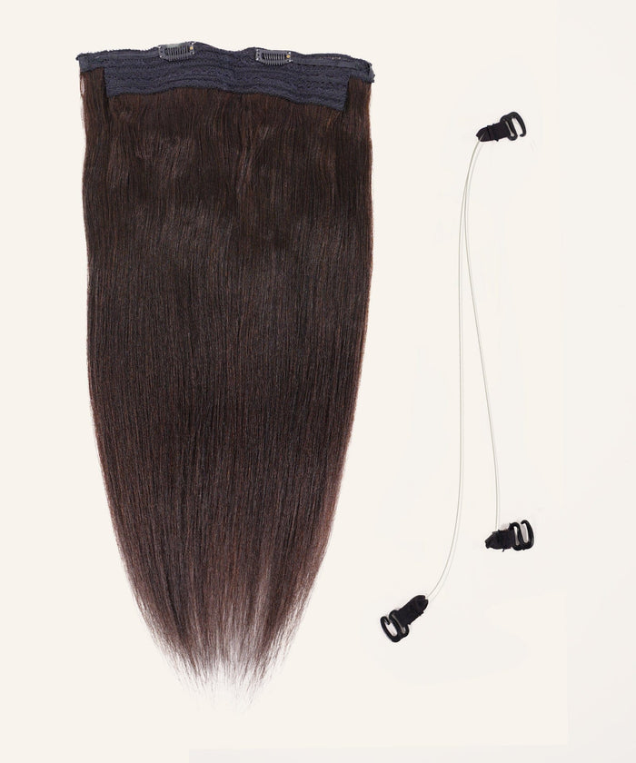 The Perfect Locks Relaxed Straight Perfect Crown Hair Extensions in natural black with top clips beside two clear elastic bands.#color_natural-black-(1B)
