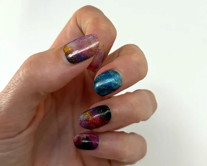 Cosmic Chic semi-cured gel nail wraps worn on the hand