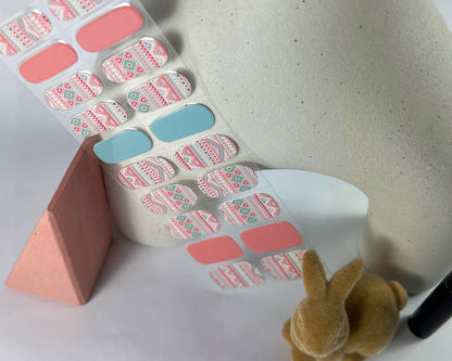 Easter PJs semi-cured gel nail wraps on a nail mock-up, alternate angle