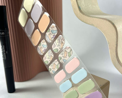 Kitty Kandy semi-cured gel nail wraps on a nail mock-up, another angle