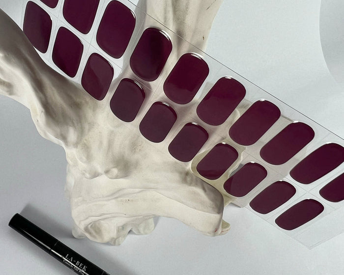 Mystic Plum semi-cured gel nail wraps on a nail mock-up