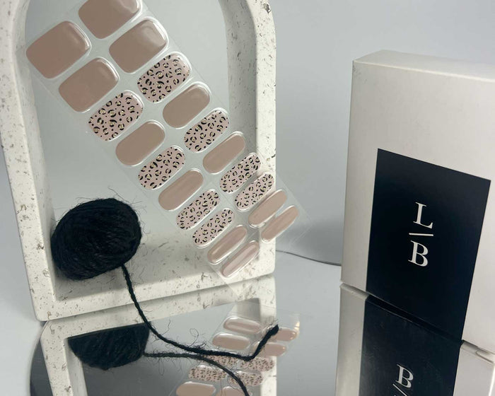 Purrluxe Blush semi-cured gel nail wraps on a nail mock-up, close-up