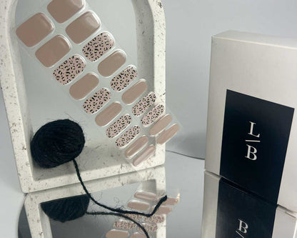 Purrluxe Blush semi-cured gel nail wraps on a nail mock-up, close-up