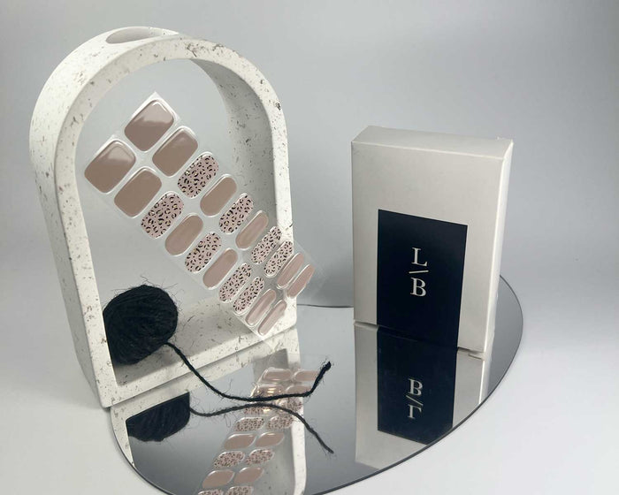 Purrluxe Blush semi-cured gel nail wraps on a nail mock-up, angled view