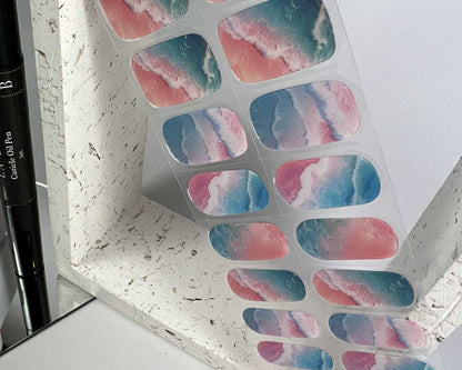 Unicorn Shore semi-cured gel nail wraps on a nail mock-up, angled view