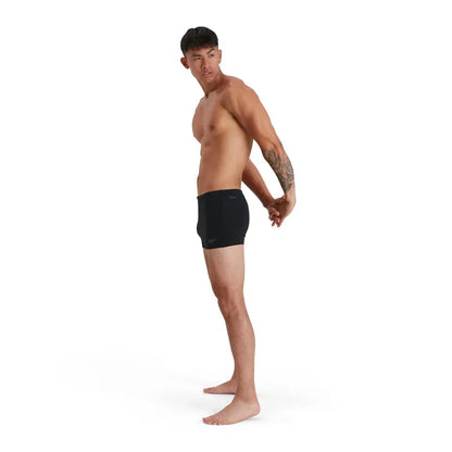 Black Speedo men's Eco Endurance+ aquashorts, close-up view showing the sleek fit and durable fabric for swimming.