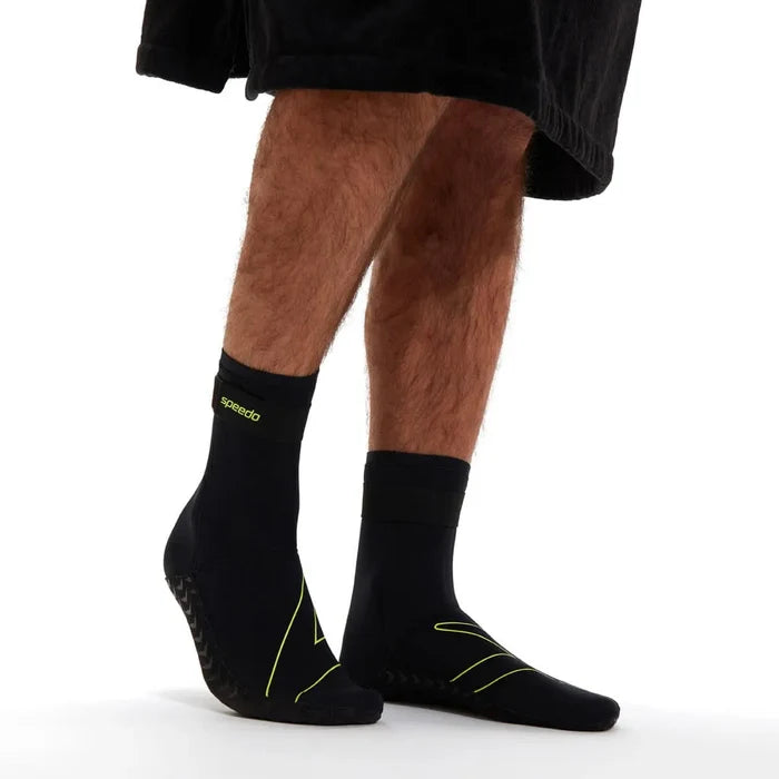 Black Speedo OW swim socks, lightweight and snug-fitting, designed for swimming and water activities.