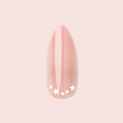 Star Halfmoon - Press-On | Long | Almond showing single long almond press-on nail in nude with white star halfmoon design manicure