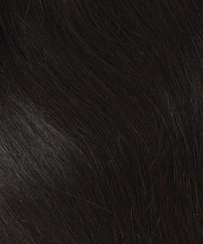 Close-up of natural black, straight hair with fine strands and natural shine, showcasing Perfect Locks' Straight Human Hair Crown Topper.#color_natural-black-(1B)