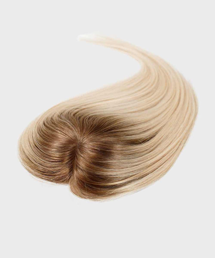 The Perfect Locks Straight Human Hair Crown Topper in rooted ash blonde is styled in a heart shape on a plain light background.#color_rooted-ash-blonde-(8/60)
