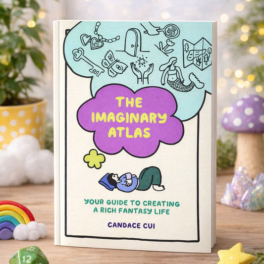 Illustrated hardcover journal with turquoise and purple cover art and title badge