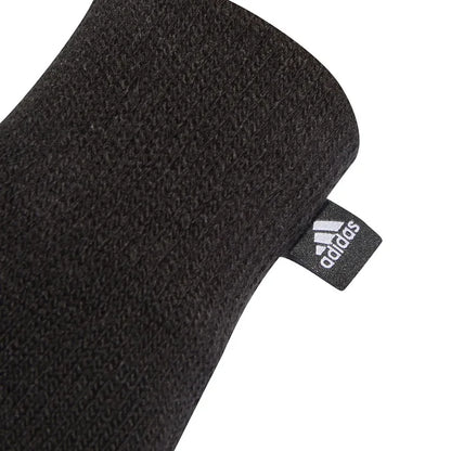 Black Adidas Three Stripes Conductive Gloves, designed for cold weather, with visible branding and textured fingertips for touch screen use.