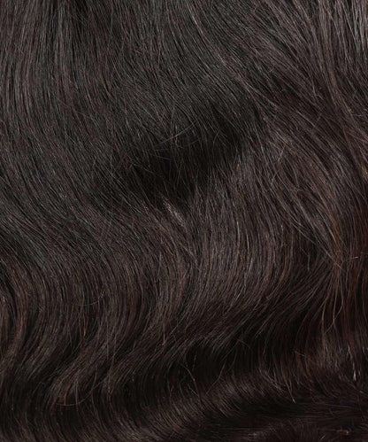 Close-up of dark brown, wavy hair with a smooth and shiny texture. Hair strands look healthy, with gentle waves and a lustrous finish.