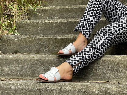 Classic European slide with fringe detail. Made in Spain from quality leathers, comfortable women's sandals/slides. In off white.